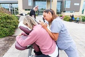 Massage therapy students massage visitors